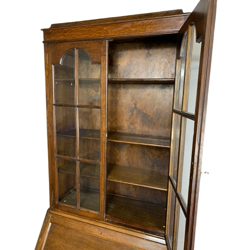 1066 - Vintage oak bureau bookcase. 83x45x205cm