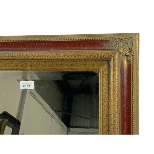 1071 - Large ornate gilt framed mirror. 110x79cm