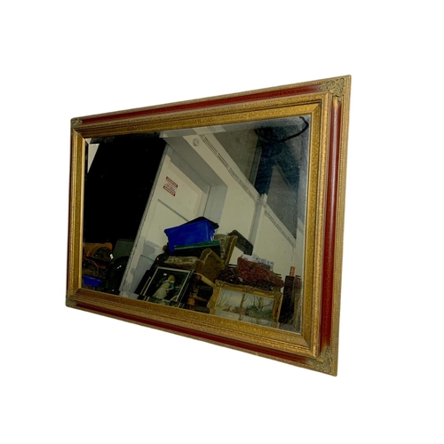 1071 - Large ornate gilt framed mirror. 110x79cm