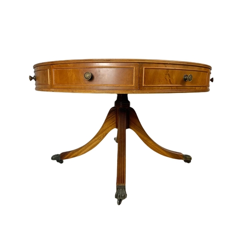 984 - Large Georgian style yew wood leather top drum table with 4 drawers. 94x57cm