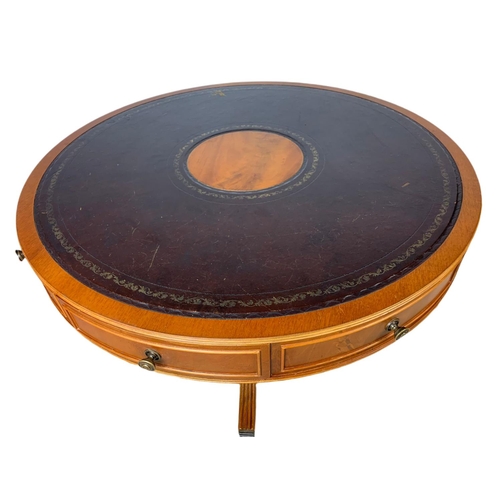 984 - Large Georgian style yew wood leather top drum table with 4 drawers. 94x57cm