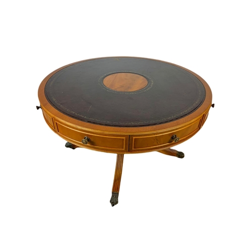 984 - Large Georgian style yew wood leather top drum table with 4 drawers. 94x57cm