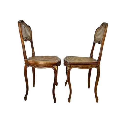 826 - Pair of late 19th century gilt French inlaid carved walnut side chairs with bergère back and seats.