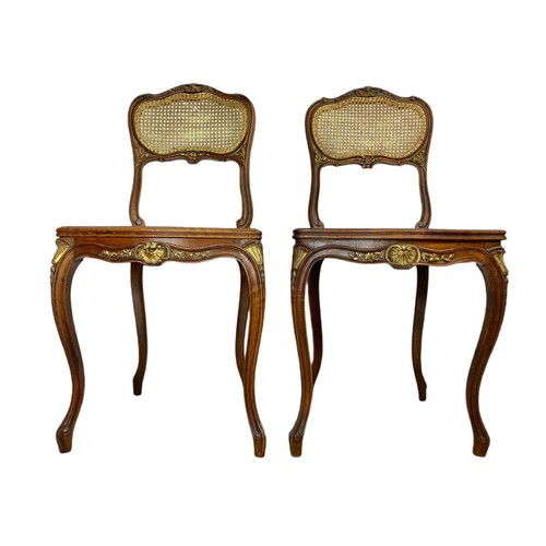 826 - Pair of late 19th century gilt French inlaid carved walnut side chairs with bergère back and seats.