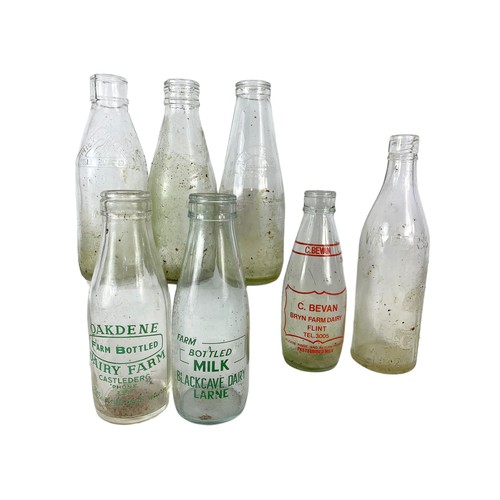 353 - 7 vintage glass bottles. Largest 28.5cm