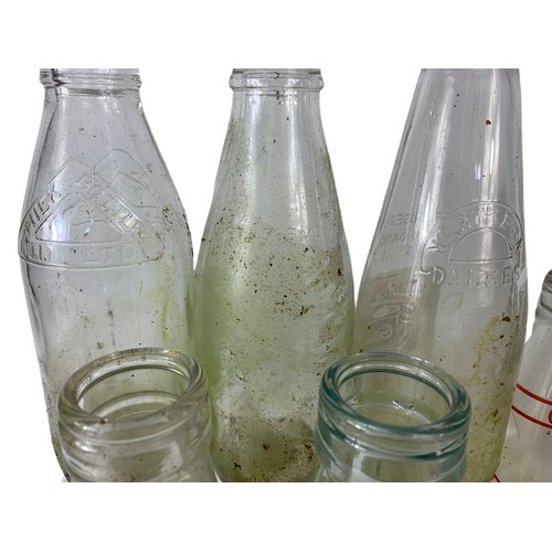 353 - 7 vintage glass bottles. Largest 28.5cm