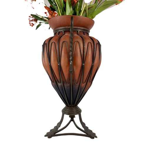 549 - Large ornate glass vase with wrought iron frame. Vase measures 52.5cm