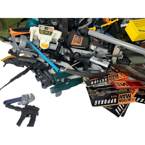 203j - Large quantity of Action Man guns, clothes and other accessories.