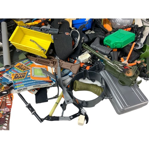 203j - Large quantity of Action Man guns, clothes and other accessories.