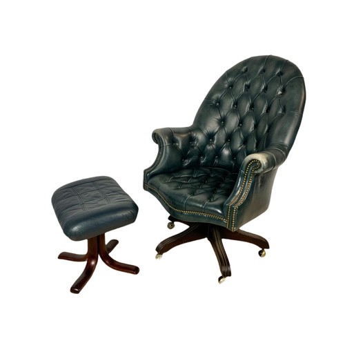 991 - High back deep button leather swivel armchair with stool. 109cm