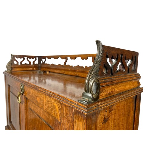 966 - Late Victorian oak fall front desk with roller shutter door compartment with brass mounts. 70x26x120... 