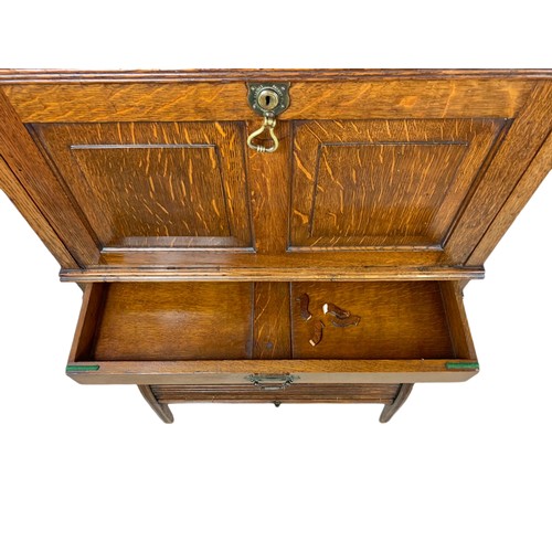 966 - Late Victorian oak fall front desk with roller shutter door compartment with brass mounts. 70x26x120... 