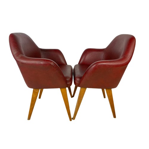 1012 - Pair of mid century Scandinavian design beech framed armchairs in burgundy vinyl