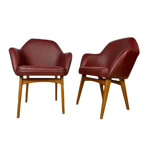 1012 - Pair of mid century Scandinavian design beech framed armchairs in burgundy vinyl