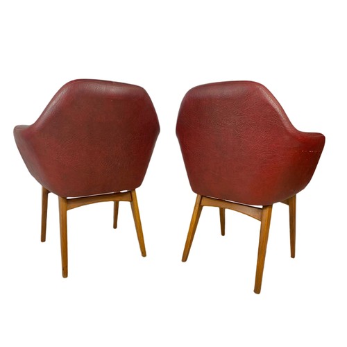 1012 - Pair of mid century Scandinavian design beech framed armchairs in burgundy vinyl