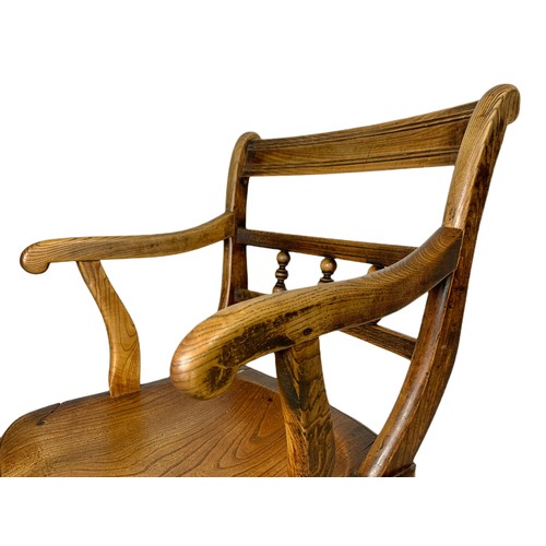 1027 - 19th century elm country house armchair.