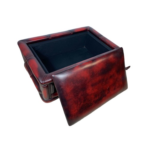 1026 - Ox blood leather storage stool. 76/50/28cm