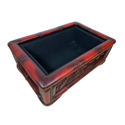 1026 - Ox blood leather storage stool. 76/50/28cm