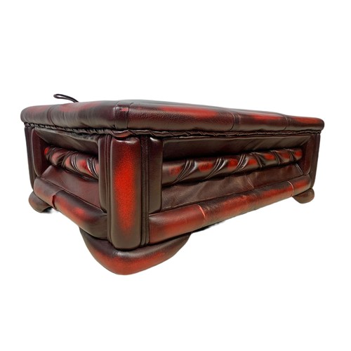 1026 - Ox blood leather storage stool. 76/50/28cm