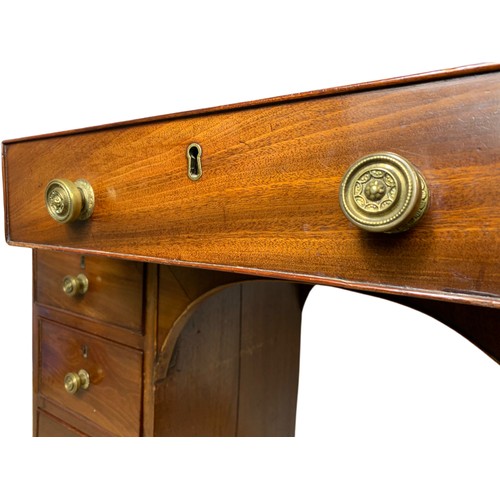 972 - Late Georgian mahogany leather top kneehole desk. 117x51.5x79.5cm