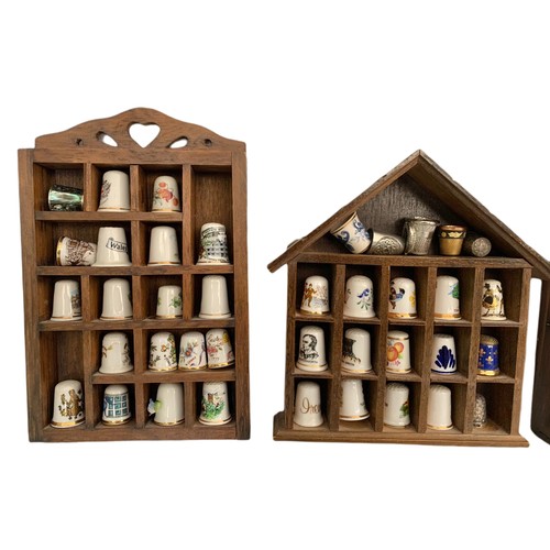 614 - Pottery thimbles and display stands. 24cm