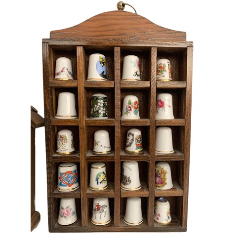 614 - Pottery thimbles and display stands. 24cm