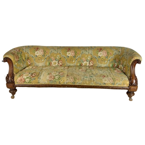 1058 - Large Victorian carved mahogany club sofa. 205.5cm