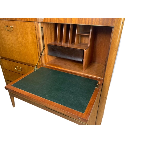 1093 - 1960’s teak mid century cocktail/writing cabinet with fitted interior.  114/41/114cm