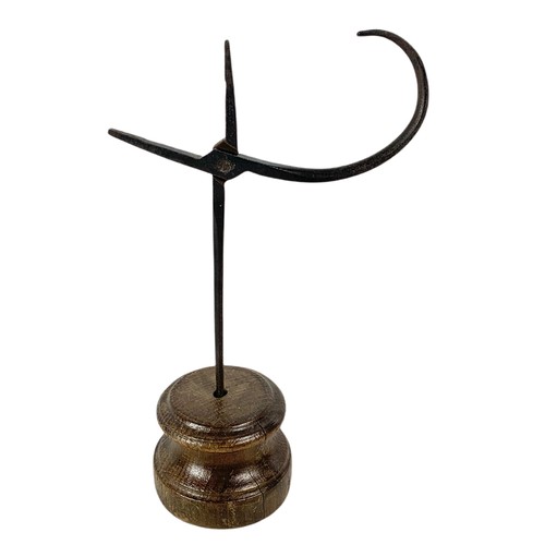 204c - Early 20th century rushlight holder and a trivet stand.  27cm and 31cm