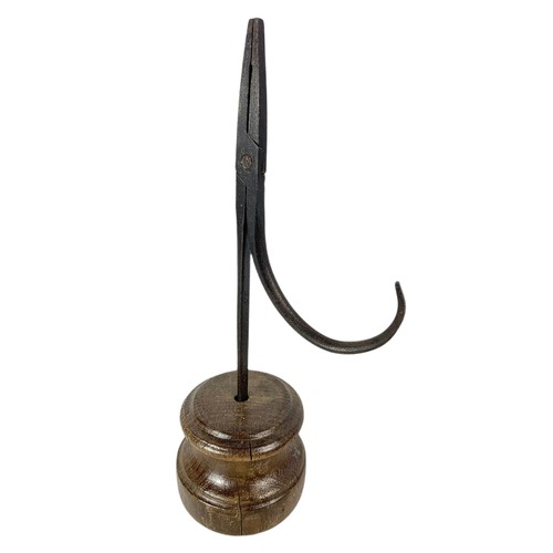 204c - Early 20th century rushlight holder and a trivet stand.  27cm and 31cm