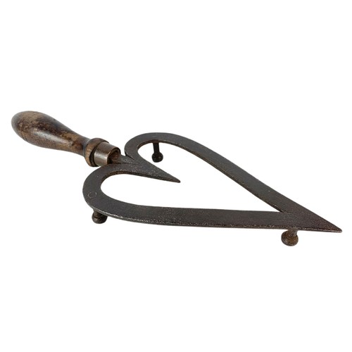 204c - Early 20th century rushlight holder and a trivet stand.  27cm and 31cm