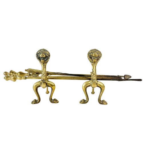 207a - Early 20th century brass fire dogs and tools.