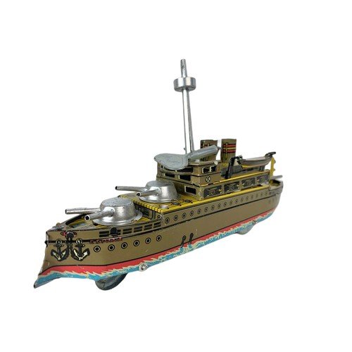 245a - Tinplate wind up toy war ship in box.  Box measures 22cm