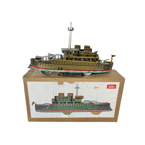 245a - Tinplate wind up toy war ship in box.  Box measures 22cm