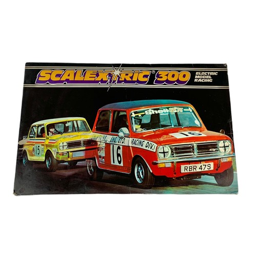 9 - Scalextic 300 electric model racing in box. Box measures 63/40/15cm