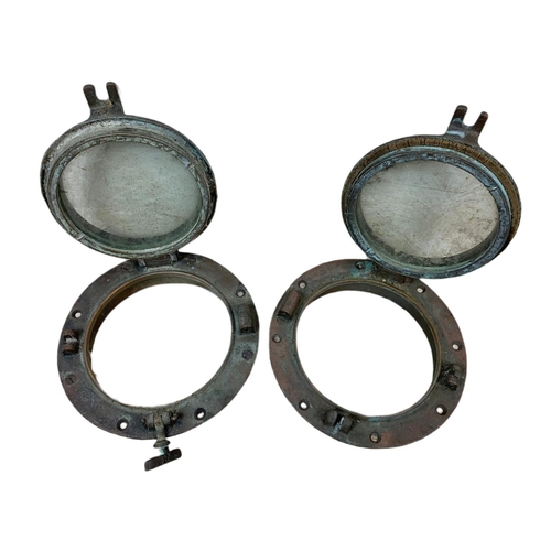 24 - Pair of late 19th/early 20th century brass ships port holes. 25cm