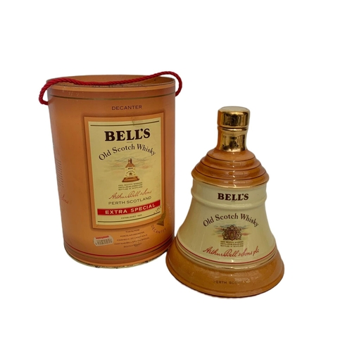 55 - Unopened Bell’s Old Scotch Whisky Extra Special. by Wade finished in 22ct gold. 75cl. 43%vol.