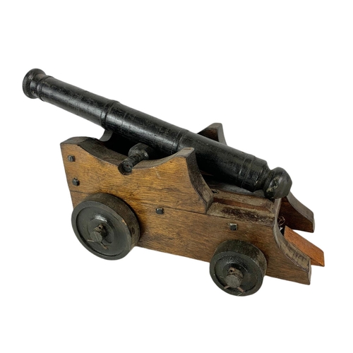 84 - Large wooden model cannon. 60/27/21cm