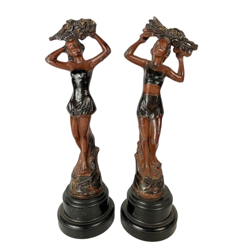 102 - Pair of early 20th century spelter figurines. 34cm