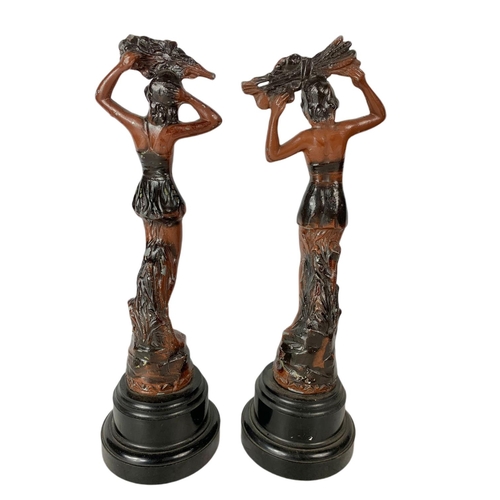 102 - Pair of early 20th century spelter figurines. 34cm