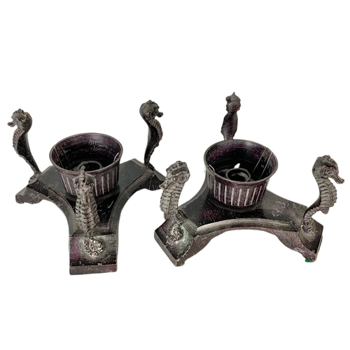 104 - Pair of vintage spelter base candle holders with glass shades. 17 x 19cm.