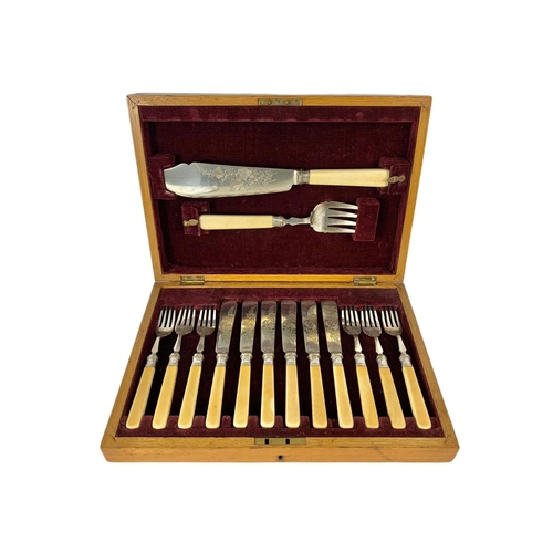 105 - Vintage silver mounted cutlery set in an oak case. 35 x 25 x 7cm