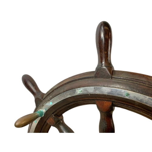 19 - Edwardian mahogany and brass ships wheel. 81cm