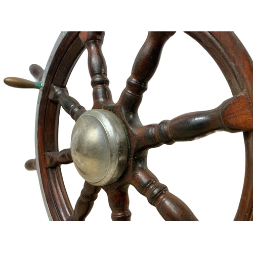 19 - Edwardian mahogany and brass ships wheel. 81cm