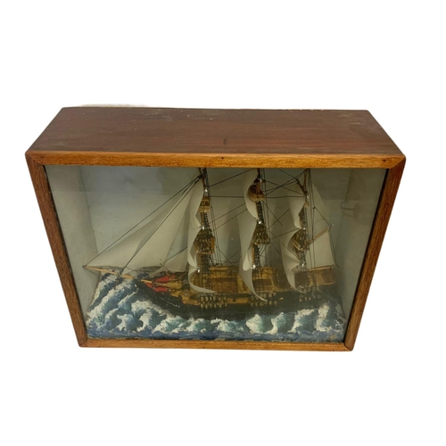 37 - Vintage model ship in a display box. 47.5/16/37cm