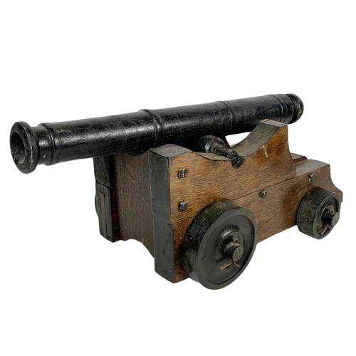 84 - Large wooden model cannon. 60/27/21cm