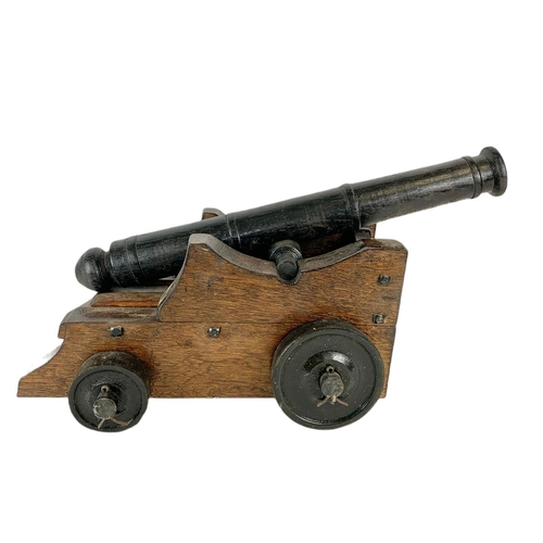 84 - Large wooden model cannon. 60/27/21cm