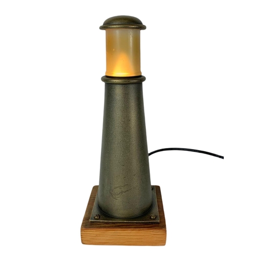 90 - Table lamp in the style of a lighthouse made from gunmetal. 34cm