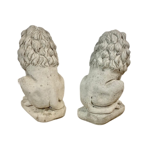 122 - Pair of concrete garden lions. 34 x 60cm