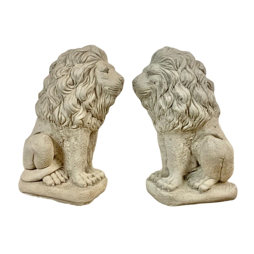 122 - Pair of concrete garden lions. 34 x 60cm